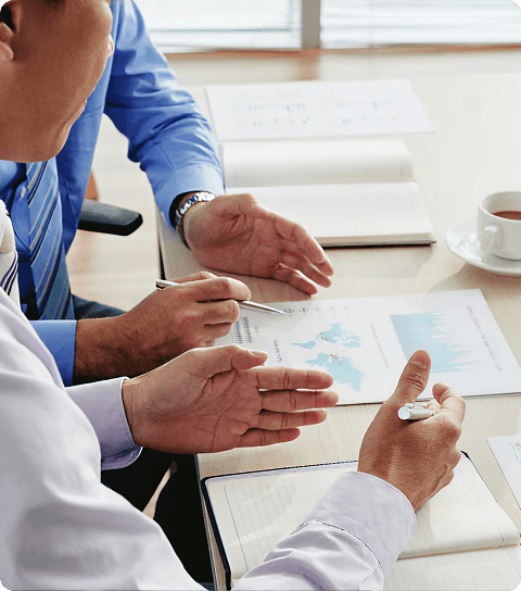 Healthcare professionals reviewing documents together at a desk
