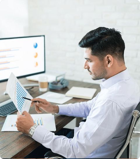 Person analyzing enrollment tracking graphs