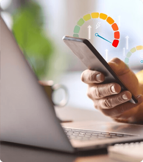 Person holding smartphone displaying risk gauge scale