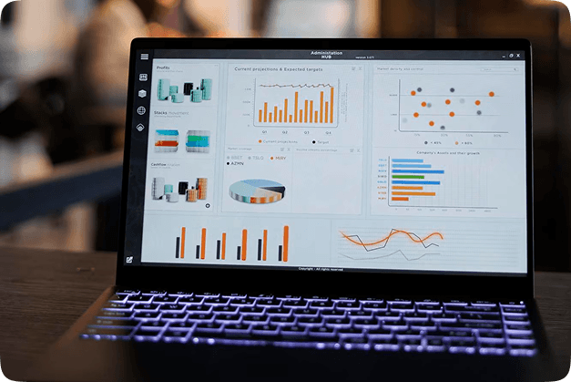 Laptop displaying detailed KPI and data visualization dashboards