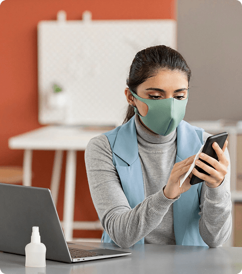 Patient using mobile phone in clinic waiting area